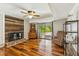 Cozy living room with wood-burning fireplace and sliding glass doors to the outdoor space at 1624 Cone Ave, Apex, NC 27502