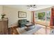 Cozy living room with hardwood floors, a window view, and comfortable seating at 1624 Cone Ave, Apex, NC 27502