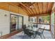 Screened porch featuring a seating area and wood flooring and ceiling at 1624 Cone Ave, Apex, NC 27502