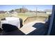 Wooden back deck with outdoor space and backyard view; grill on deck at 173 Silver Tee Ct, Selma, NC 27576