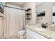 Bathroom featuring granite countertop vanity, decorative mirror, and shower with curtain at 173 Silver Tee Ct, Selma, NC 27576