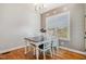 Cozy dining room featuring wood floors, natural light, and stylish decor at 173 Silver Tee Ct, Selma, NC 27576