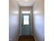 Entryway with striking blue door, hardwood floors, and soft, natural light at 173 Silver Tee Ct, Selma, NC 27576