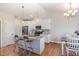 Modern kitchen boasts stainless steel appliances, island, and adjacent dining area at 173 Silver Tee Ct, Selma, NC 27576