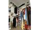 Walk-in closet with ample shelving and hanging racks providing plenty of storage at 173 Silver Tee Ct, Selma, NC 27576