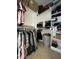 Walk-in closet with ample storage space including shelving and hanging racks at 173 Silver Tee Ct, Selma, NC 27576