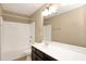 Bathroom with a combination bathtub and shower, toilet, sink, and modern lighting at 2 White Spruce Ct, Durham, NC 27703