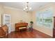Dining room with hardwood floors and a large window at 2 White Spruce Ct, Durham, NC 27703