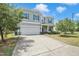Two-story home with a two-car garage and a long driveway at 2 White Spruce Ct, Durham, NC 27703