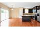 Spacious kitchen featuring stainless steel appliances, a large island, and opens to the dining area at 2 White Spruce Ct, Durham, NC 27703