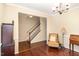Inviting living room with hardwood floors, staircase, and classic furniture, offering a cozy and elegant atmosphere at 2 White Spruce Ct, Durham, NC 27703