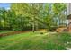 The exterior features a sprawling lawn surrounded by a wooden fence at 2004 Valley Ridge Ct, Raleigh, NC 27603