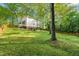 Exterior of home featuring a lawn surrounded by a backyard at 2004 Valley Ridge Ct, Raleigh, NC 27603