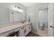 Bathroom showcasing double vanity, sink, lighting fixture, countertop space, and walk-in closet at 2004 Valley Ridge Ct, Raleigh, NC 27603