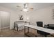 This bedroom offers a ceiling fan, carpeted floors, a bed, and a desk at 2004 Valley Ridge Ct, Raleigh, NC 27603
