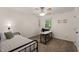 Functional bedroom offers a work space and cozy sleeping area near a bright window at 2004 Valley Ridge Ct, Raleigh, NC 27603