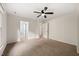 Spacious bedroom with a ceiling fan and a doorway leading to an ensuite bathroom at 2004 Valley Ridge Ct, Raleigh, NC 27603