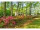 Scenic view of the home exterior with flowers and lush foliage at 2004 Valley Ridge Ct, Raleigh, NC 27603