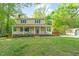Charming two-story home with a covered front porch and well-maintained lawn at 2004 Valley Ridge Ct, Raleigh, NC 27603