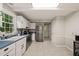 Traditional kitchen features white cabinets, stainless steel appliances, and a neutral backsplash at 2004 Valley Ridge Ct, Raleigh, NC 27603
