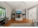 Bright living room with hardwood floors, a stone fireplace and decorative plants at 2004 Valley Ridge Ct, Raleigh, NC 27603
