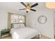 Bedroom with natural light, ceiling fan, hardwood floors, and a black metal bed frame at 2014 Walnut St, Durham, NC 27705