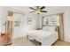 Bedroom with natural light, ceiling fan, hardwood floors, and a black metal bed frame at 2014 Walnut St, Durham, NC 27705