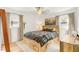 Bedroom with a wooden platform bed, hardwood floors, and lots of natural light at 2014 Walnut St, Durham, NC 27705