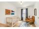 Bedroom with crib, patterned rug, leather rocking chair, and natural light from the window at 2014 Walnut St, Durham, NC 27705