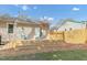 A deck area with seating, a privacy fence, and a well-maintained lawn at 2014 Walnut St, Durham, NC 27705