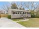 Charming single-story home with a well-maintained front yard, concrete driveway, and welcoming entrance at 2014 Walnut St, Durham, NC 27705