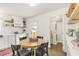 Charming kitchen with a dining table, stainless steel appliances, and convenient laundry access at 2014 Walnut St, Durham, NC 27705