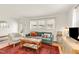 Stylish living room featuring hardwood floors, comfortable seating, and lots of natural light at 2014 Walnut St, Durham, NC 27705