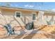 A cozy outdoor patio area with a grill and seating at 2014 Walnut St, Durham, NC 27705