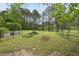 Mature trees adorn this expansive backyard, offering a tranquil and private retreat at 207 Ashley Brook Ct, Cary, NC 27513