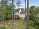 A beautiful backyard is showcased with a two-level deck and privacy provided by trees at 207 Ashley Brook Ct, Cary, NC 27513