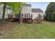 Spacious backyard featuring a two-level deck, mature trees, and well-maintained lawn at 207 Ashley Brook Ct, Cary, NC 27513