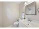 Neat half bath with a classic sink, toilet, and decor at 207 Ashley Brook Ct, Cary, NC 27513