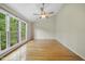 Spacious bedroom with vaulted ceilings, a ceiling fan and scenic window views at 207 Ashley Brook Ct, Cary, NC 27513