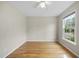 Bedroom featuring hardwood floors and a window providing ample natural light at 207 Ashley Brook Ct, Cary, NC 27513