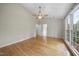 Bright bedroom features hardwood floors, natural light and ensuite bathroom access at 207 Ashley Brook Ct, Cary, NC 27513