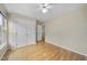 Bedroom with hardwood floors, large closet and an additional door leading to another room at 207 Ashley Brook Ct, Cary, NC 27513