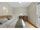 Cozy bedroom with natural light, hardwood floors, and a woven dresser at 207 Ashley Brook Ct, Cary, NC 27513