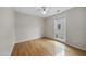 Bedroom featuring hardwood floors, a ceiling fan, and window with blinds at 207 Ashley Brook Ct, Cary, NC 27513