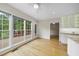 Charming breakfast nook with large windows, white trim, and views of the outdoor deck at 207 Ashley Brook Ct, Cary, NC 27513