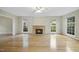 Inviting living room features a fireplace and large windows at 207 Ashley Brook Ct, Cary, NC 27513