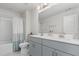 Bright and airy bathroom featuring double sinks, modern fixtures, and shower/tub combo with stylish tiling at 217 Braeburn Dr, Graham, NC 27253