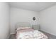 Minimalist bedroom design with light pink bedding and coordinated furniture, perfect for relaxation and rest at 217 Braeburn Dr, Graham, NC 27253