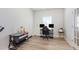 Bedroom features a crib and desk/gaming area, offering flexibility at 217 Braeburn Dr, Graham, NC 27253