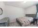 Cozy bedroom with gray furnishings and a colorful floral quilt creating a welcoming atmosphere at 217 Braeburn Dr, Graham, NC 27253